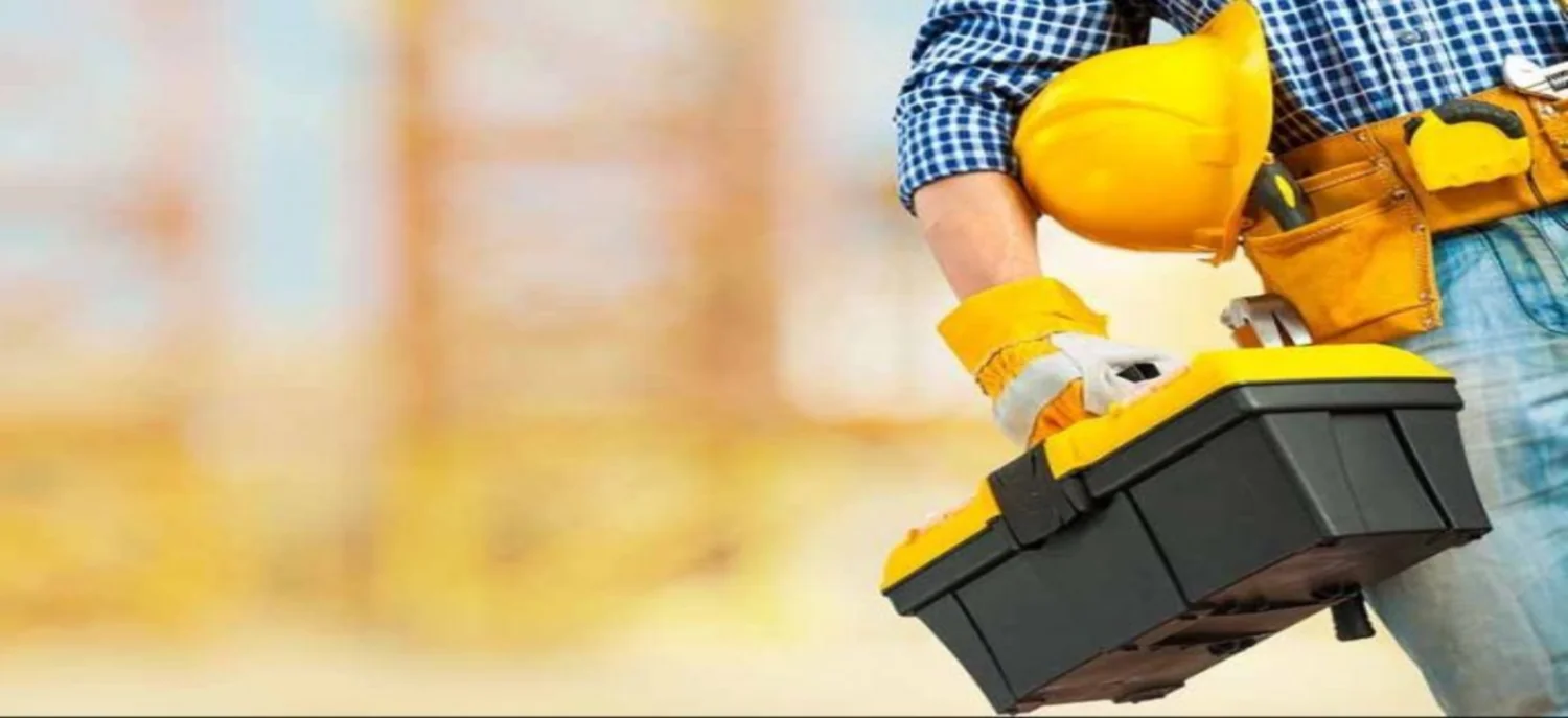 SKN technician on a Dubai worksite with tools and equipment